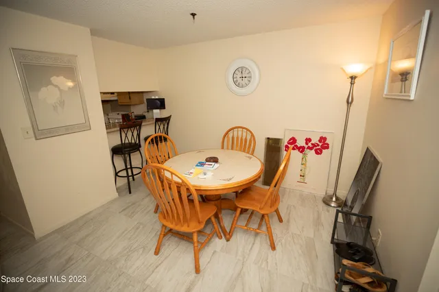 a kitchen with a refrigerator a stove top oven a counter space and cabinets