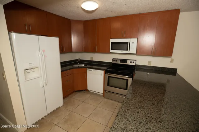 a bedroom with a bed and a cabinets