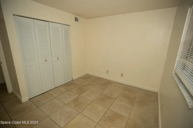 a view of a workspace with furniture and a flat screen tv