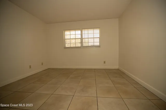 a view of kitchen island with stainless steel appliances granite countertop sink stove and cabinets