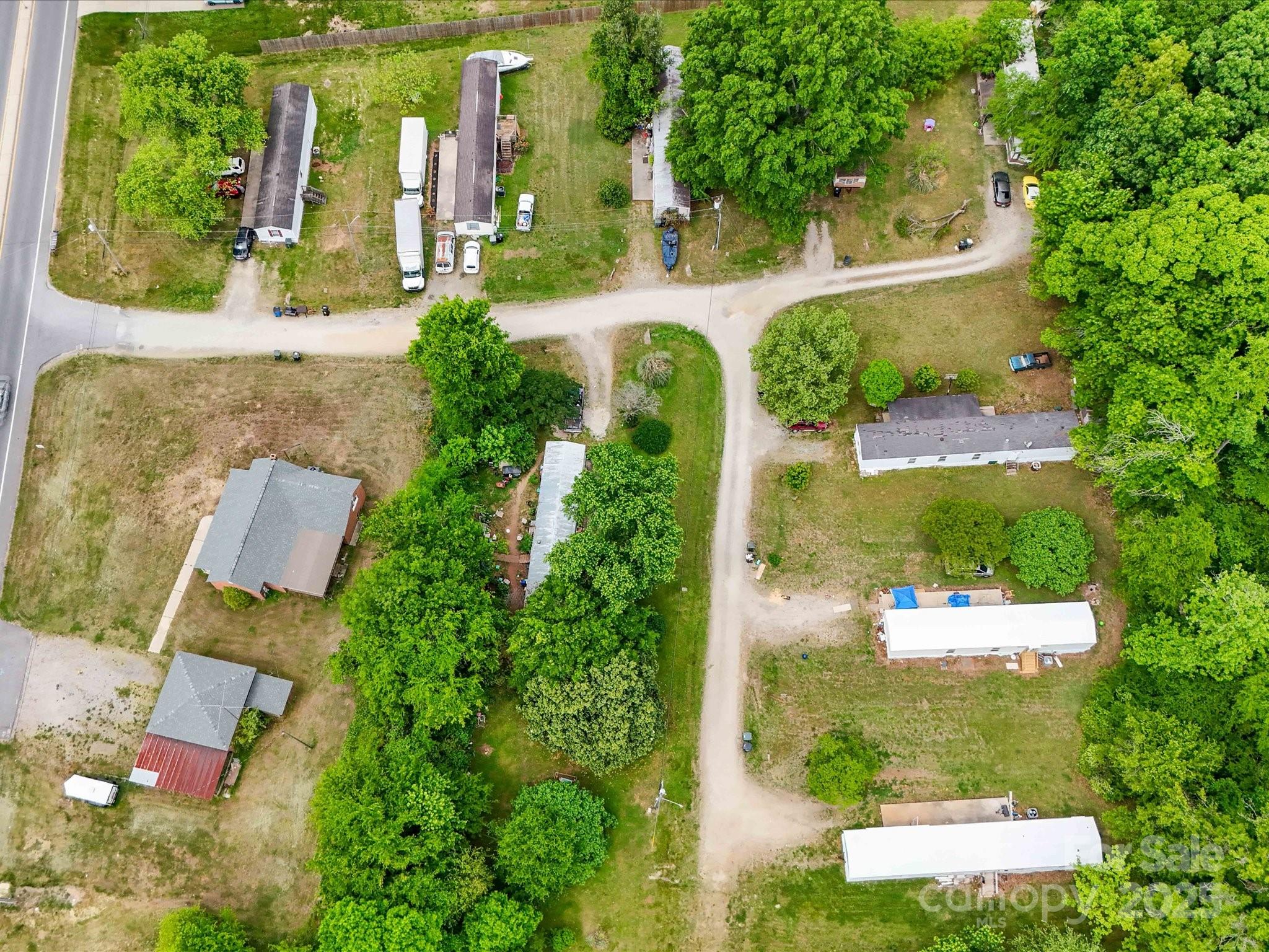 4940 Weddington Road Concord, NC 28027 - Photo 3 of 14 an aerial view of a house with a yard and garden