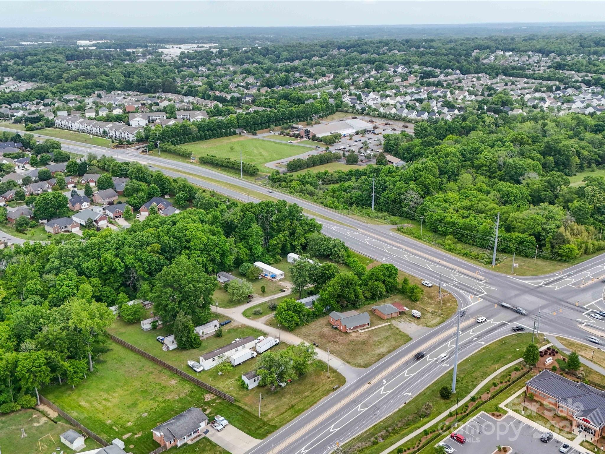 4940 Weddington Road Concord, NC 28027 - Photo 6 of 14 an aerial view of residential houses with outdoor space and trees