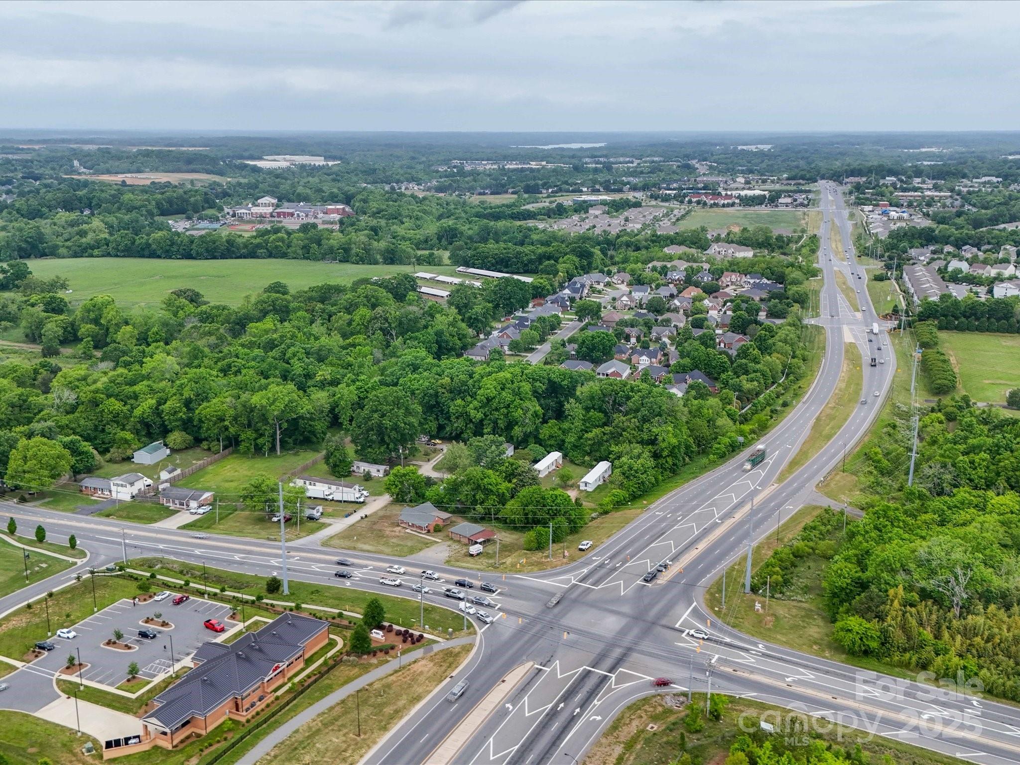 4940 Weddington Road Concord, NC 28027 - Photo 8 of 14 an aerial view of residential houses with outdoor space and trees