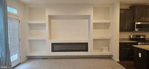 a kitchen with a stove and a microwave