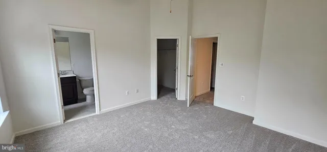 a view of empty room with closet
