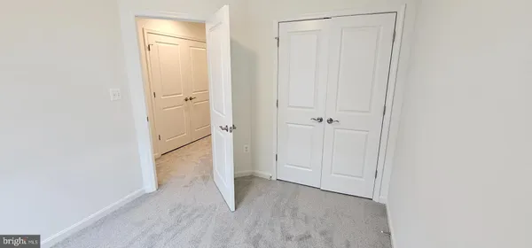 a view of a bathroom from the hallway