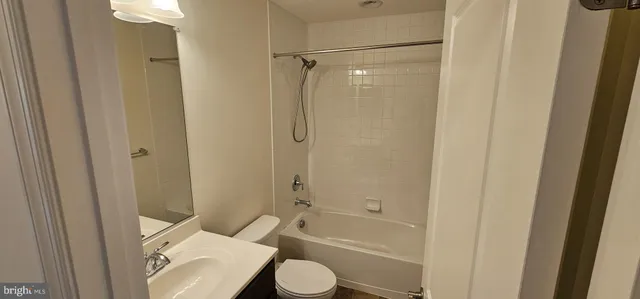 a room with a sink and a toilet