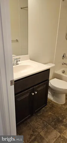 a backyard of a house with barbeque oven