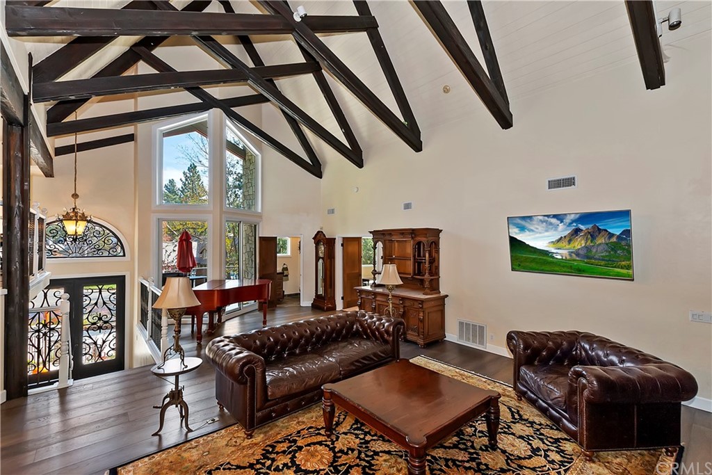 27880 Peninsula Drive North Lake Arrowhead, CA 92352 - Photo 6 of 69 a living room with furniture and a flat screen tv