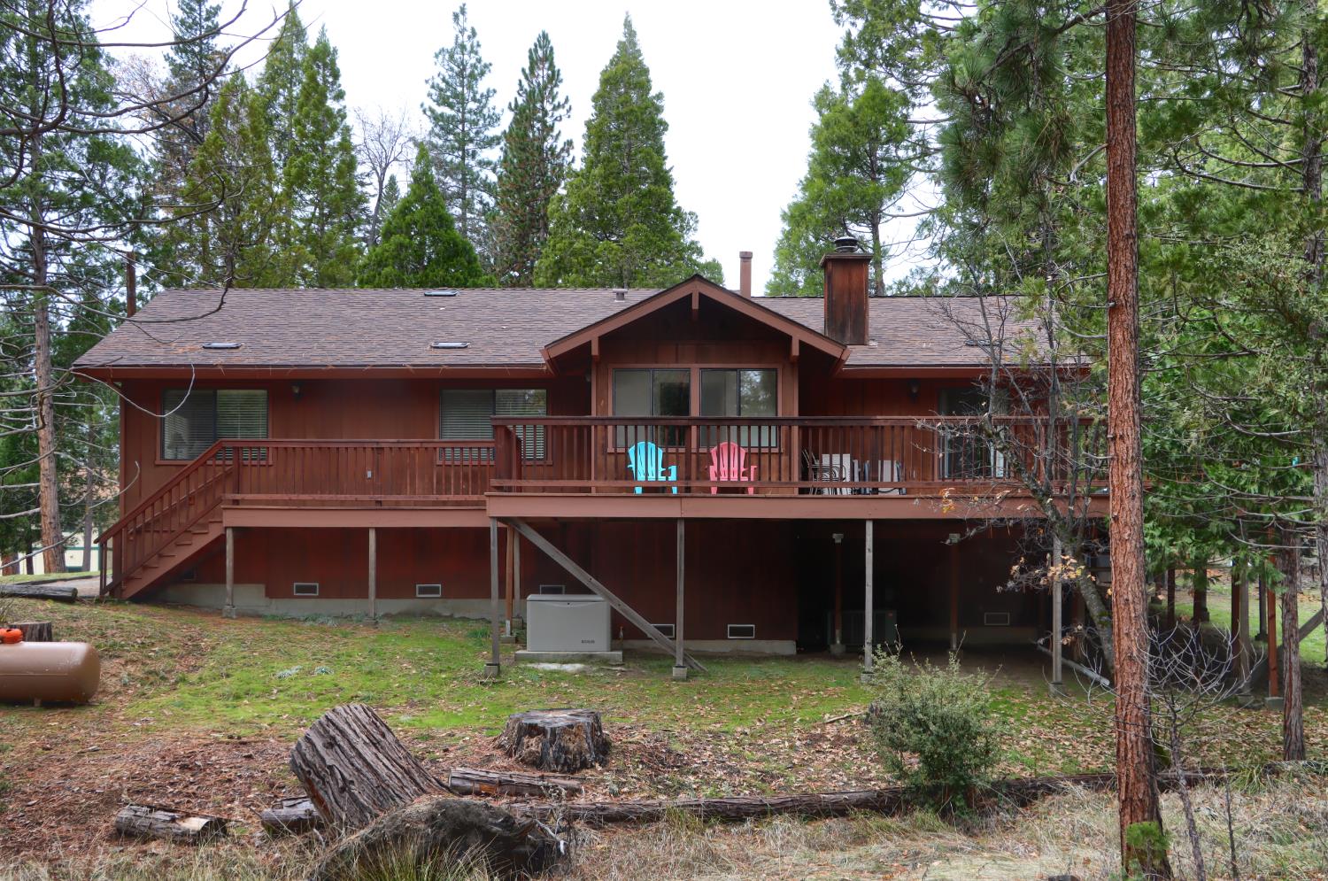 8041 Chilnualna Falls Road Wawona, CA 95389 - Photo 40 of 46 a view of a house with a yard and sitting area