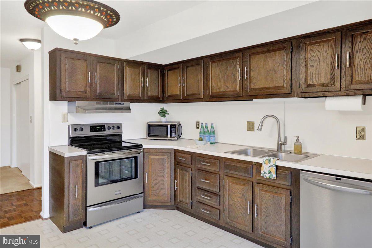 10 D Fairway Road Reading, PA 19607 - Photo 2 of 12 a kitchen with stainless steel appliances granite countertop a sink stove and cabinets
