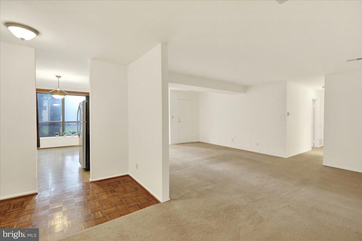 10 D Fairway Road Reading, PA 19607 - Photo 4 of 12 an empty room with wooden floor and windows