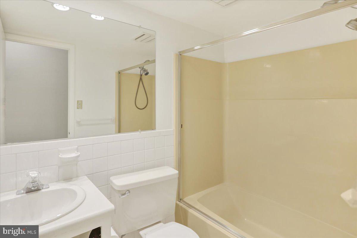 10 D Fairway Road Reading, PA 19607 - Photo 10 of 12 a bathroom with a shower curtain and a sink