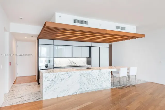 a view of a bedroom with wooden floor and bedroom