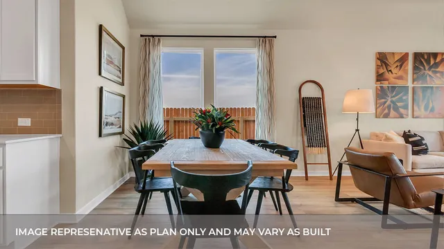 a view of kitchen with furniture and a potted plant
