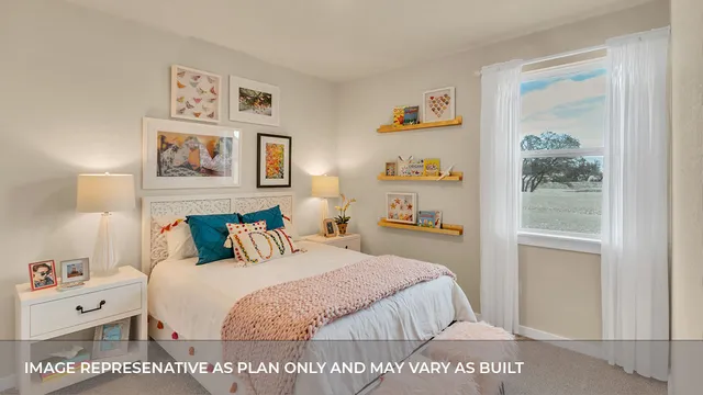 a bedroom with a bed and a night stand