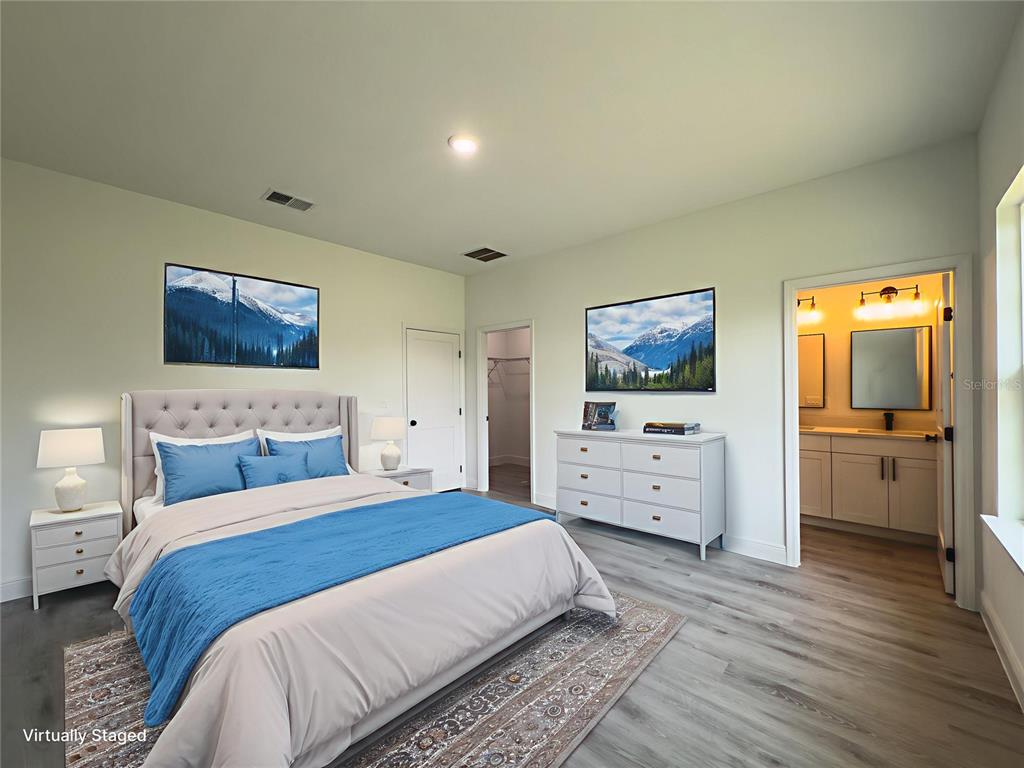 14481 Southwest 29th Terrace Ocala, FL 34473 - Photo 15 of 31 a bedroom with a bed and a flat screen tv