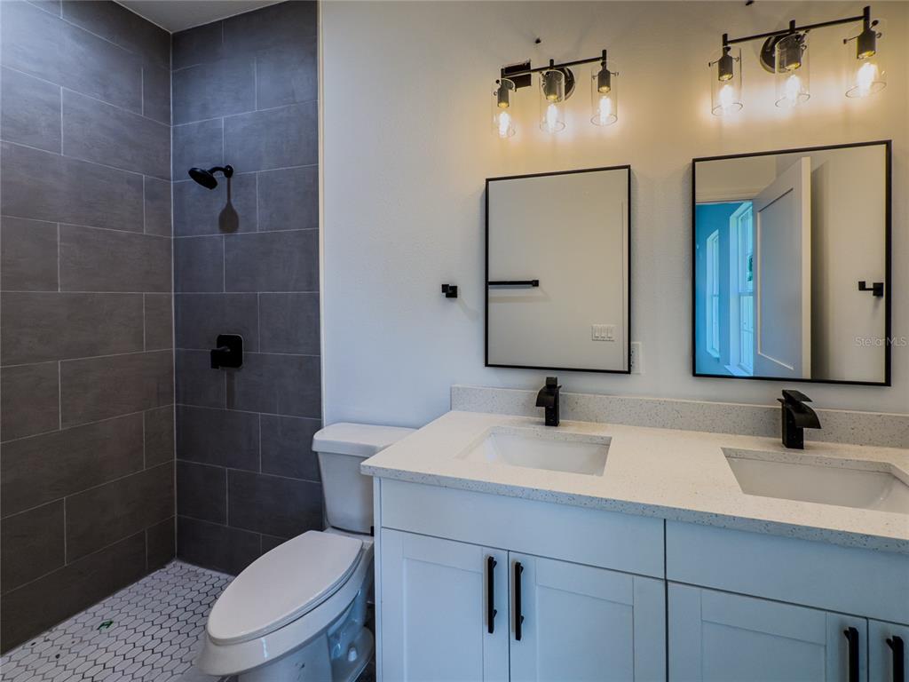 14481 Southwest 29th Terrace Ocala, FL 34473 - Photo 17 of 31 a bathroom with a toilet sink and mirror