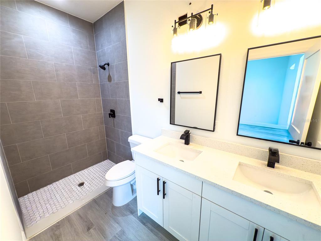 14481 Southwest 29th Terrace Ocala, FL 34473 - Photo 18 of 31 a bathroom with a sink a toilet and shower