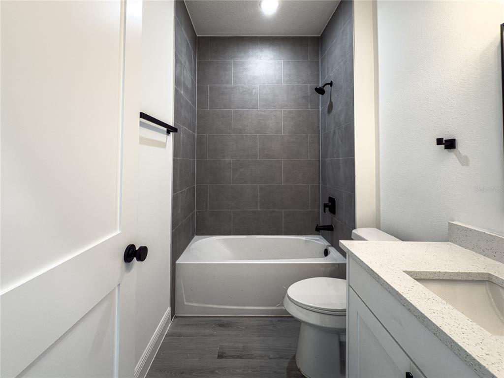 14481 Southwest 29th Terrace Ocala, FL 34473 - Photo 27 of 31 a bathroom with a sink a toilet and shower