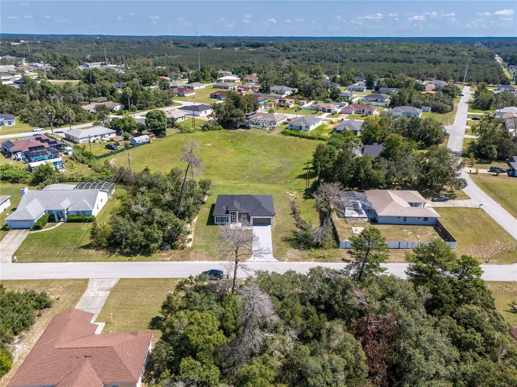 14481 Southwest 29th Terrace Ocala, FL 34473 - Photo 4 of 31 an aerial view of residential houses with outdoor space and trees