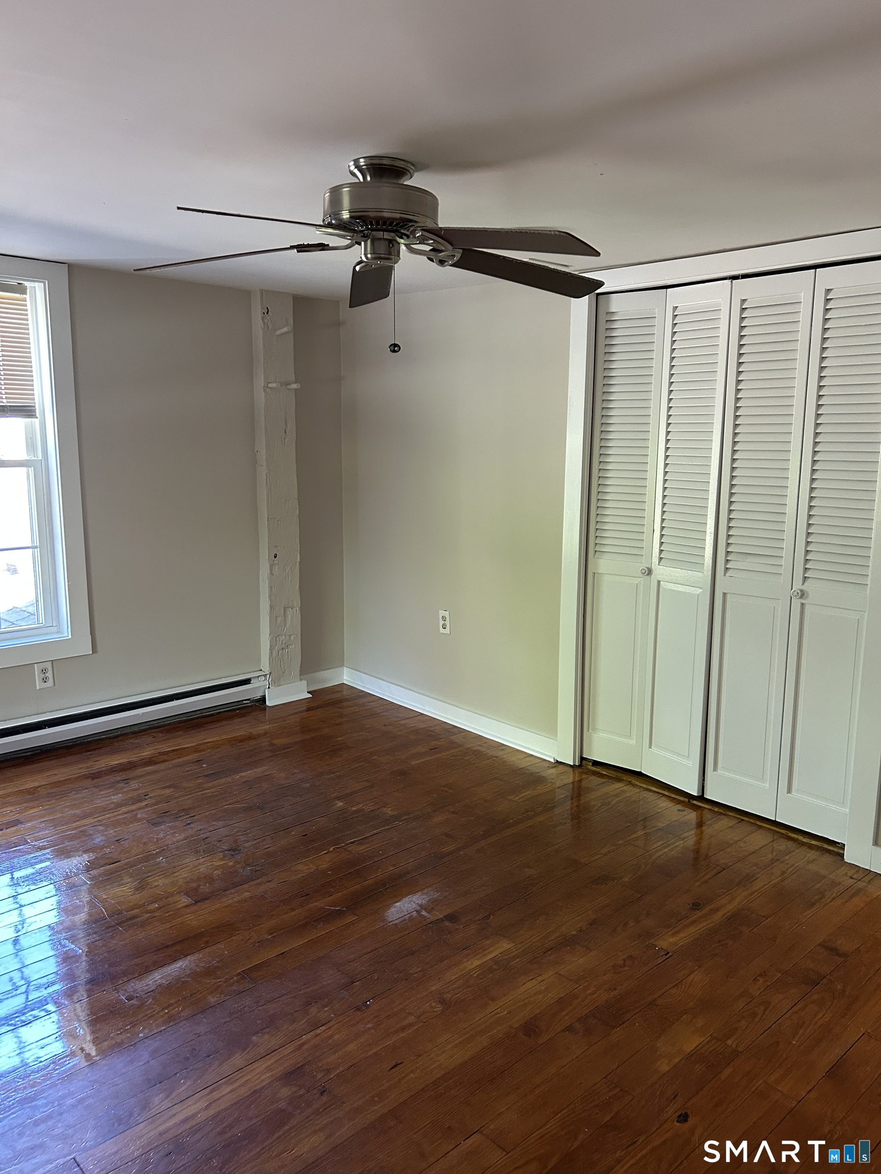 4 Weekeepeemee Road Woodbury, CT 06798 - Photo 14 of 22 an empty room with wooden floor closet and windows