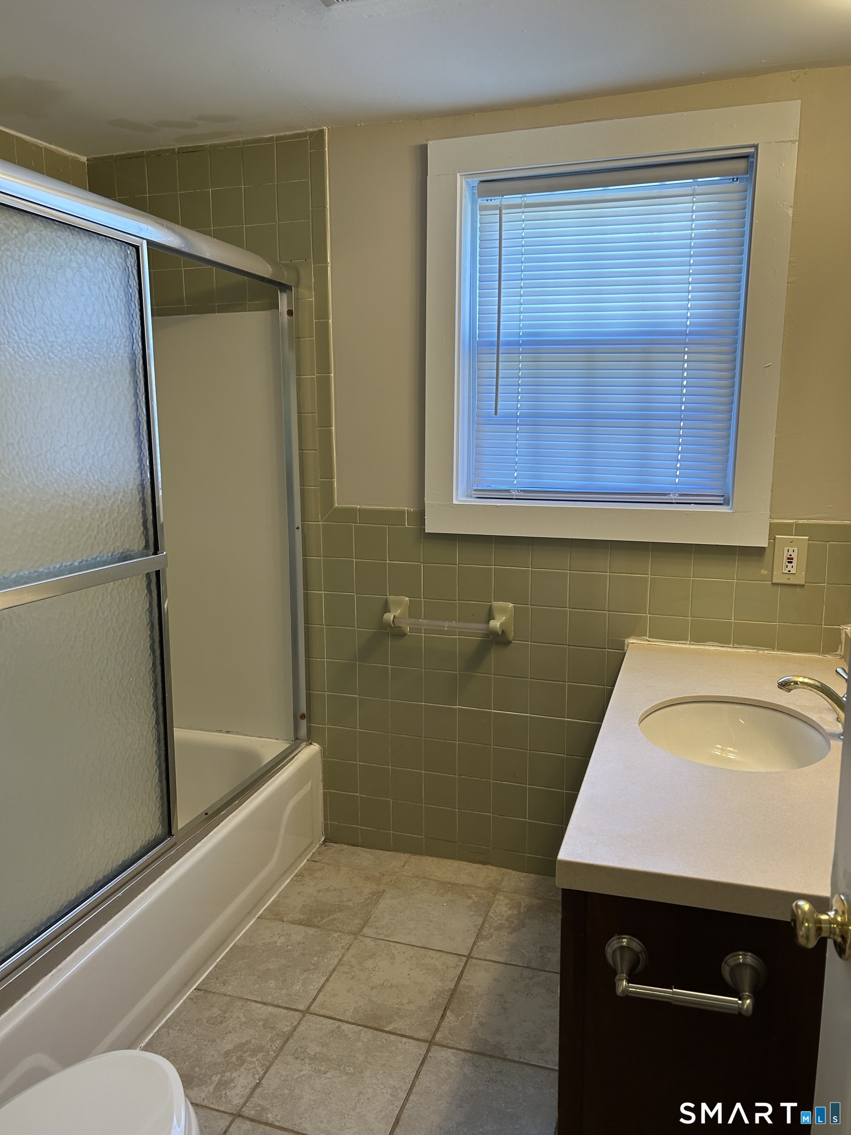 4 Weekeepeemee Road Woodbury, CT 06798 - Photo 17 of 22 a bathroom with a sink and a shower