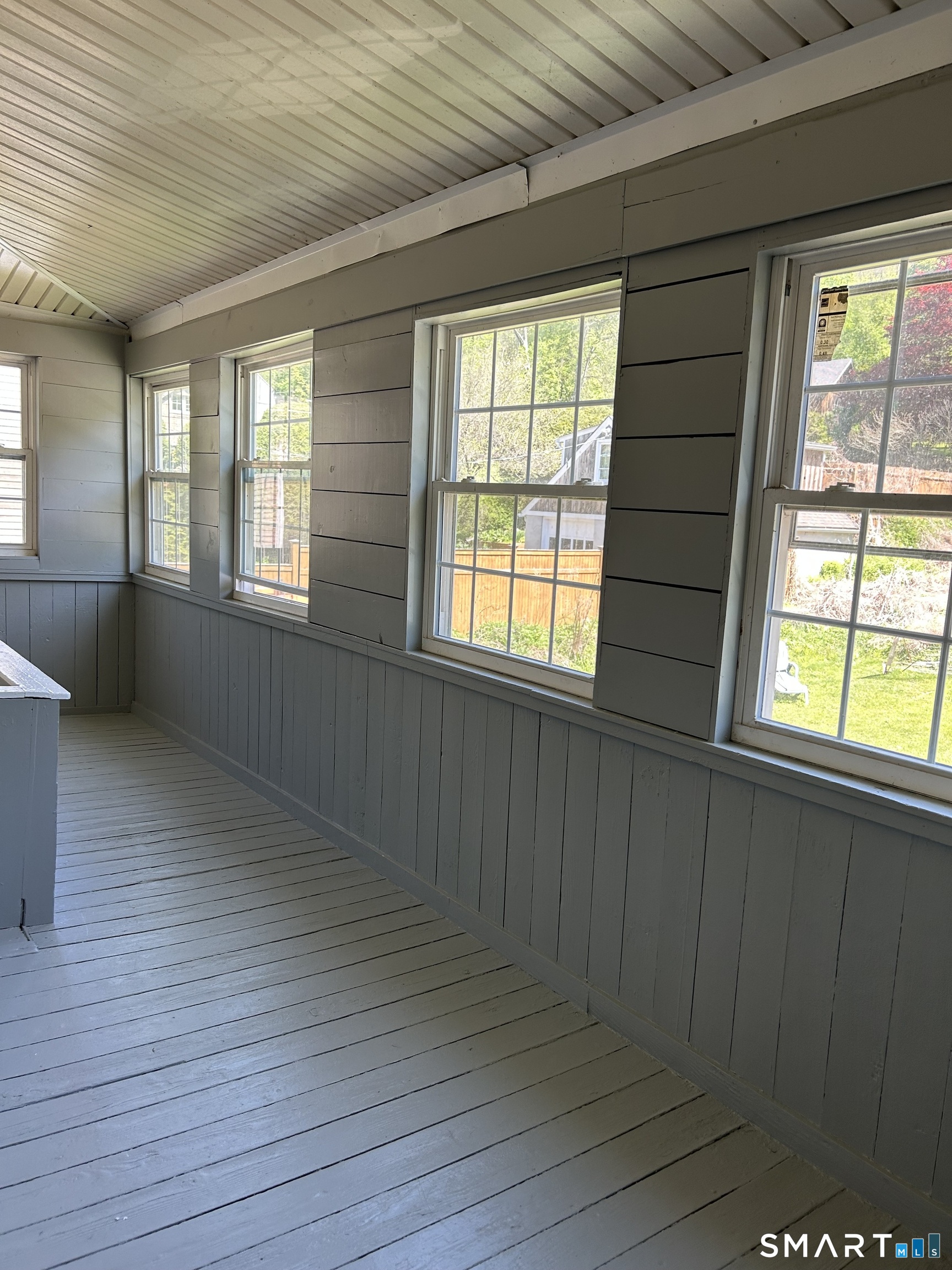 4 Weekeepeemee Road Woodbury, CT 06798 - Photo 19 of 22 a view of an empty room with wooden floor and a window