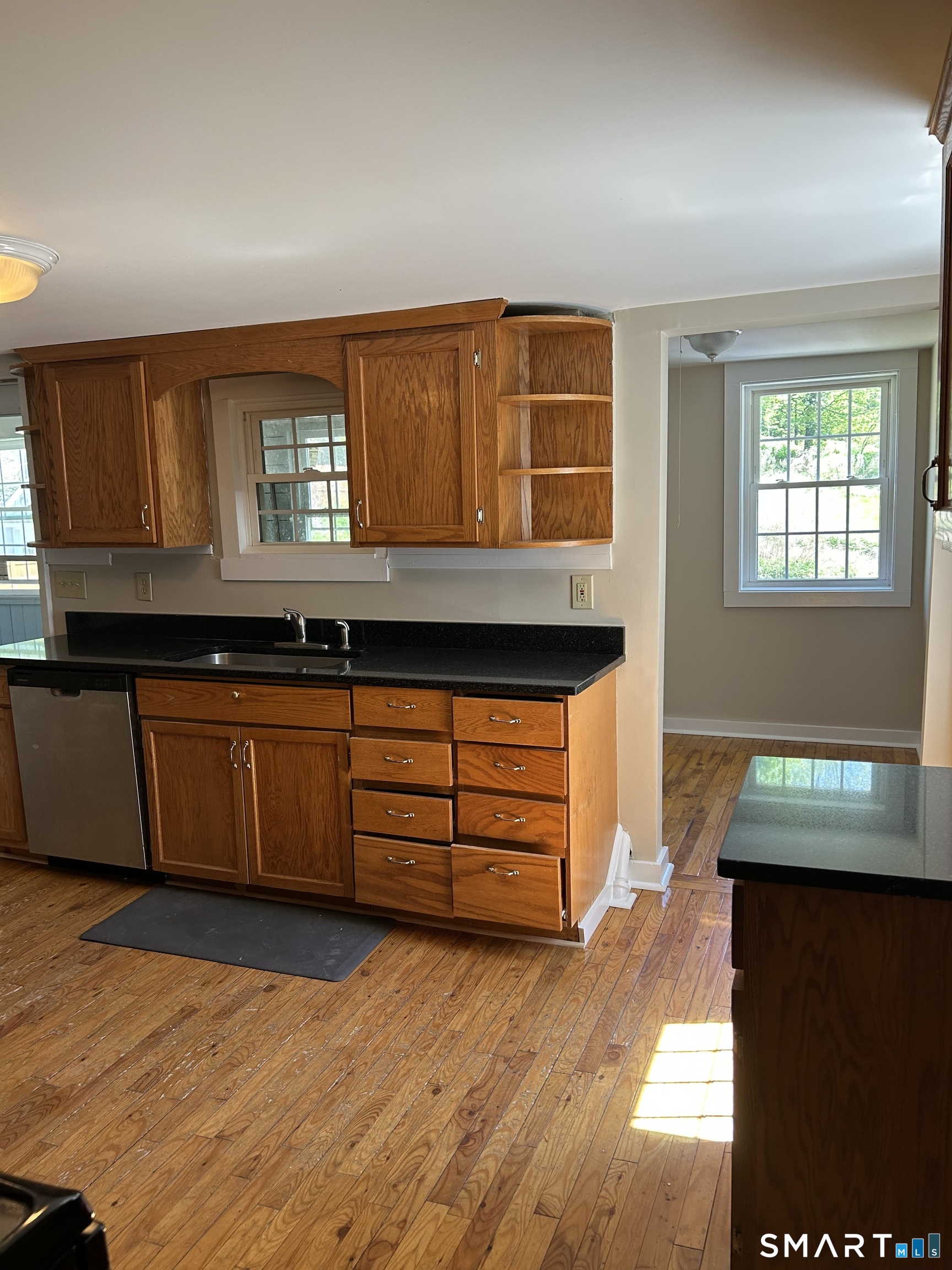 4 Weekeepeemee Road Woodbury, CT 06798 - Photo 2 of 22 a kitchen with granite countertop a stove a sink and a granite counter tops
