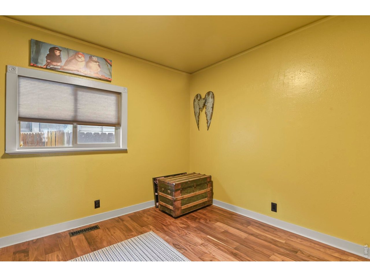 417 2nd Street Fort Lupton, CO 80621 - Photo 15 of 24 a view of a room with wooden floor and a window