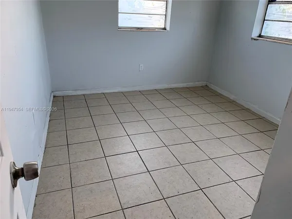 a bathroom with a toilet and a bath tub