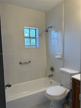 a kitchen with granite countertop a sink stove and refrigerator