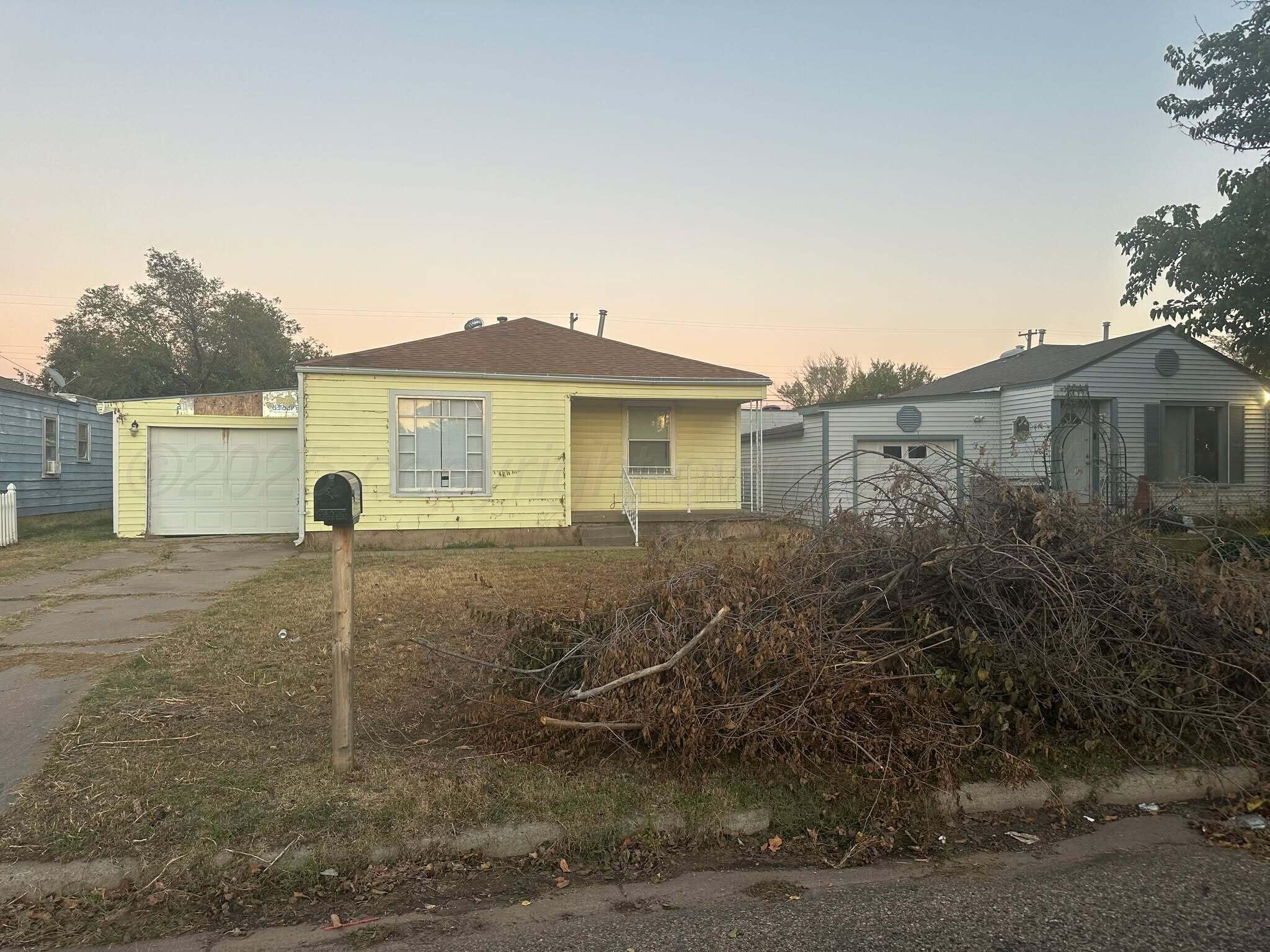 1933 South Seminole Street Amarillo, TX 79103 - Photo 1 of 7 a view of a house with a backyard