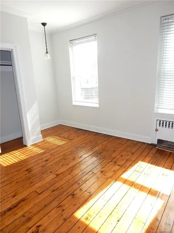 a view of an empty room and window