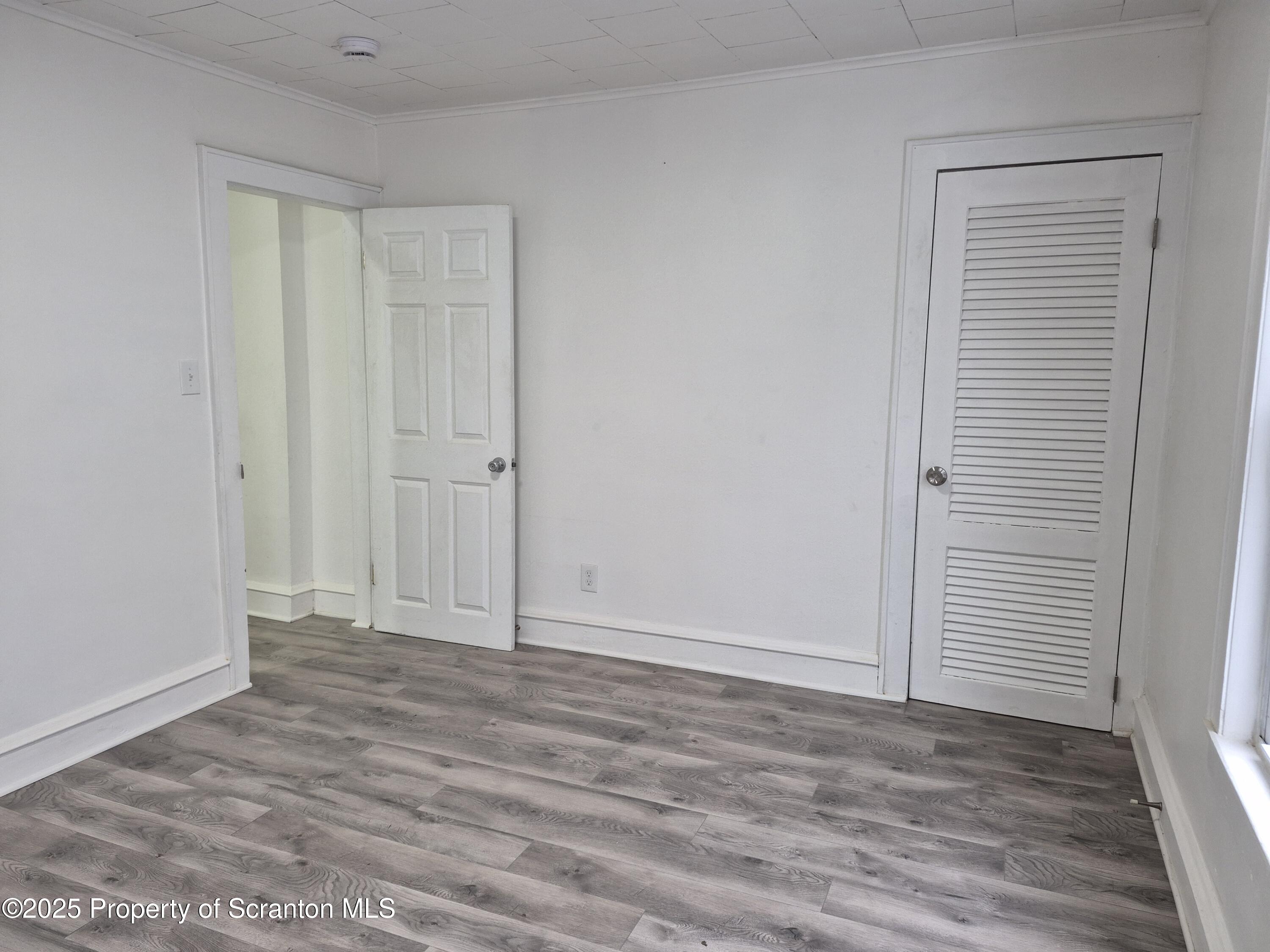 1758 Wayne Avenue Scranton, PA 18508 - Photo 12 of 20 a view of an empty room with wooden floor