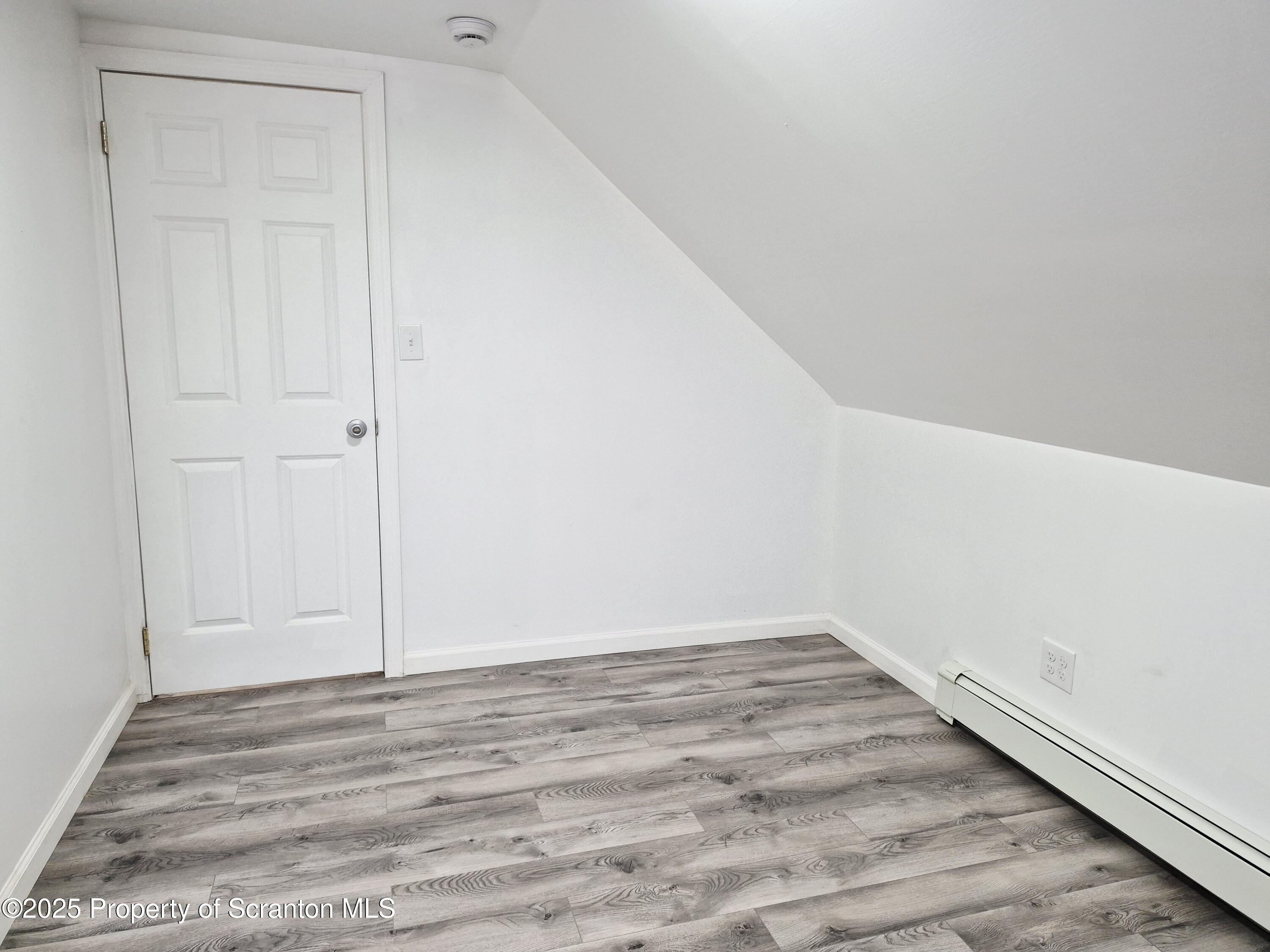 1758 Wayne Avenue Scranton, PA 18508 - Photo 18 of 20 a view of a room with wooden floor