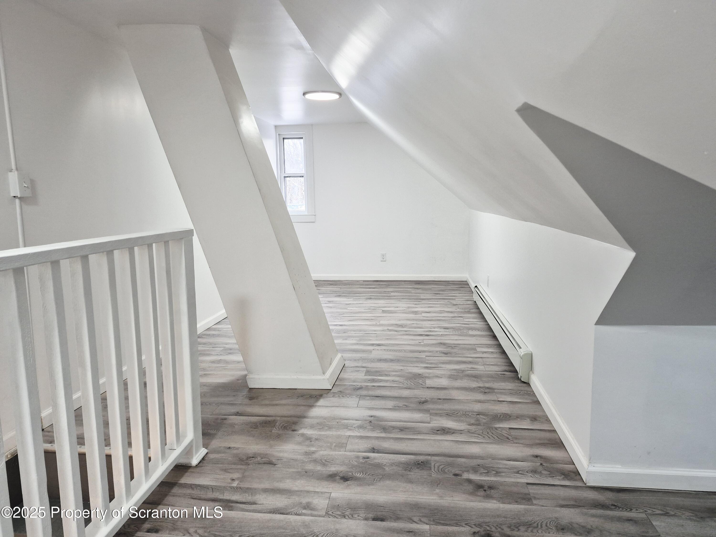 1758 Wayne Avenue Scranton, PA 18508 - Photo 19 of 20 a view of staircase with white walls and a window