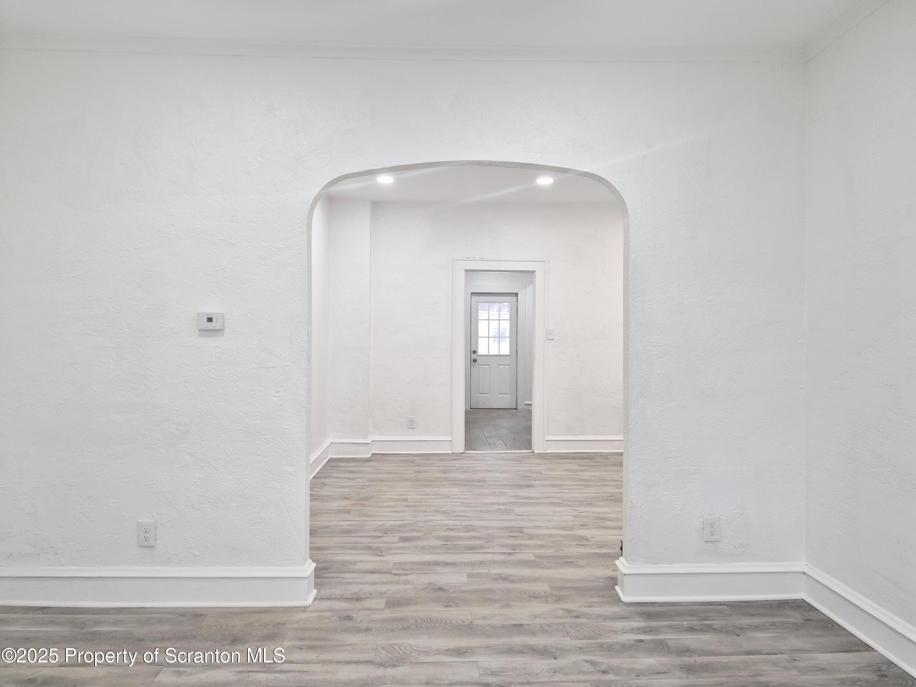 1758 Wayne Avenue Scranton, PA 18508 - Photo 3 of 20 a view of a hallway with wooden floor