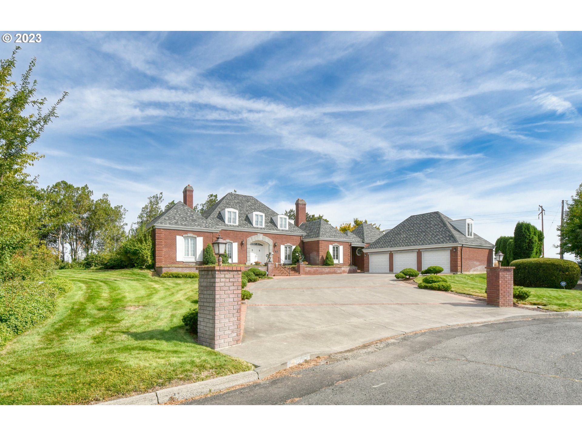 1092 Skyline Drive Pendleton, OR 97801 - Photo 2 of 47 a view of a big house with a big yard and large trees