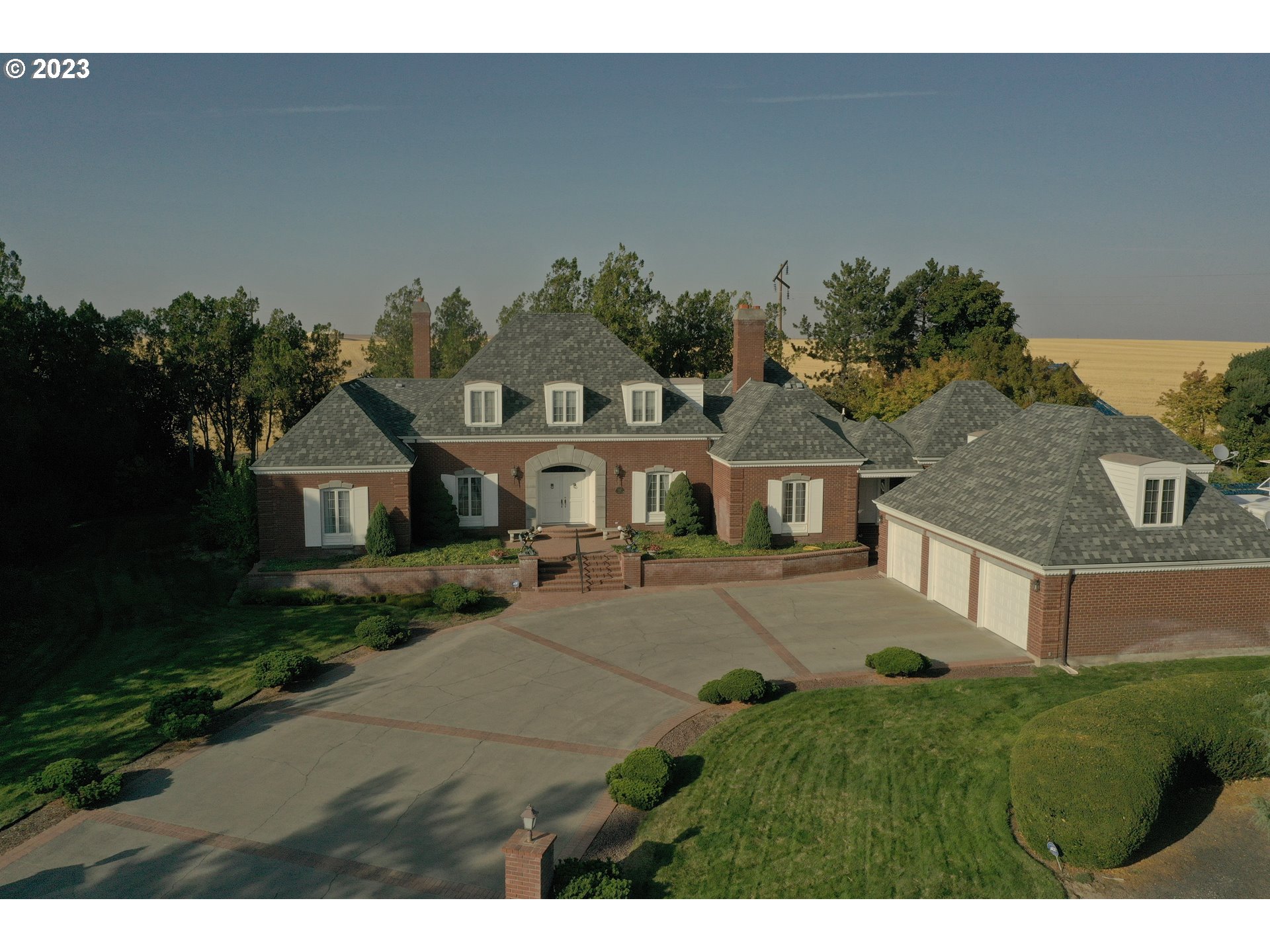 1092 Skyline Drive Pendleton, OR 97801 - Photo 3 of 47 a front view of a house with a yard and garage