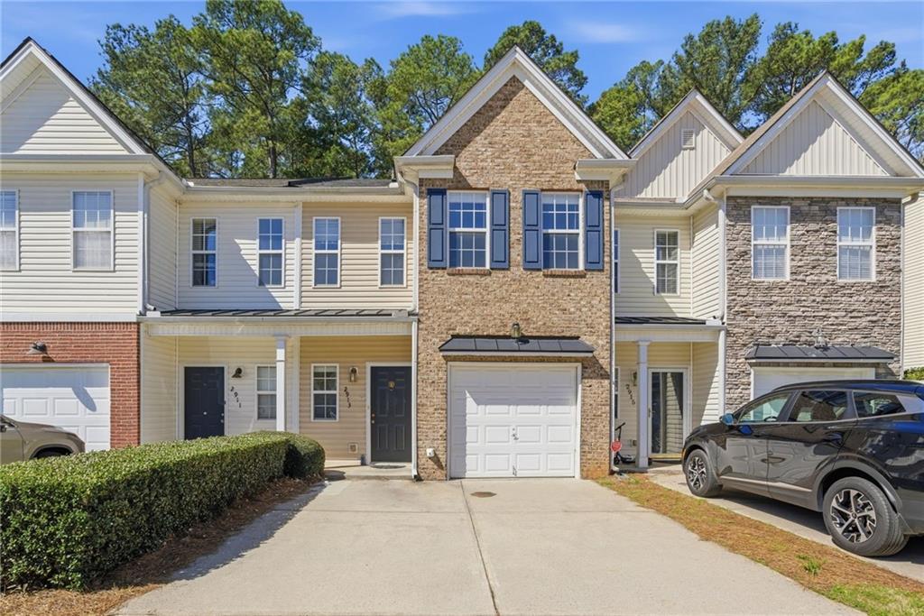 2913 Greyhawk Lane Cumming, GA 30040 - Photo 1 of 44 a front view of a house with parking space