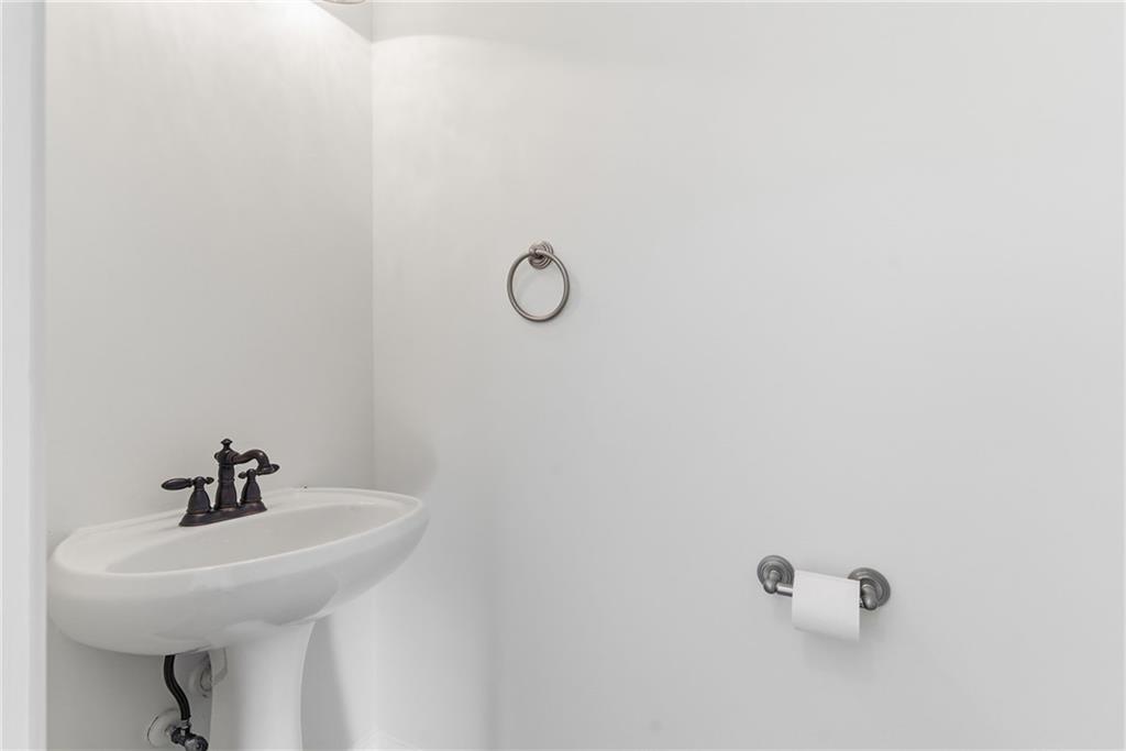 2913 Greyhawk Lane Cumming, GA 30040 - Photo 17 of 44 a bathroom with a sink and mirror