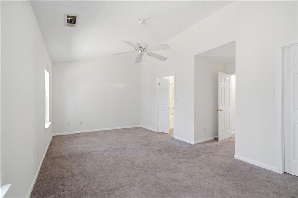 2913 Greyhawk Lane Cumming, GA 30040 - Photo 23 of 44 an empty room with a fan & a ceiling fan
