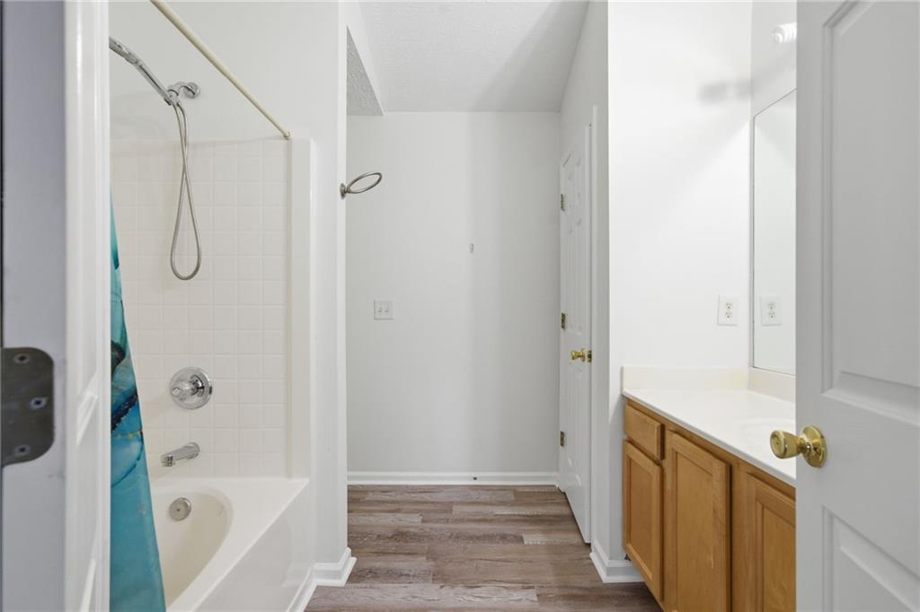 2913 Greyhawk Lane Cumming, GA 30040 - Photo 26 of 44 a bathroom with a bathtub and shower