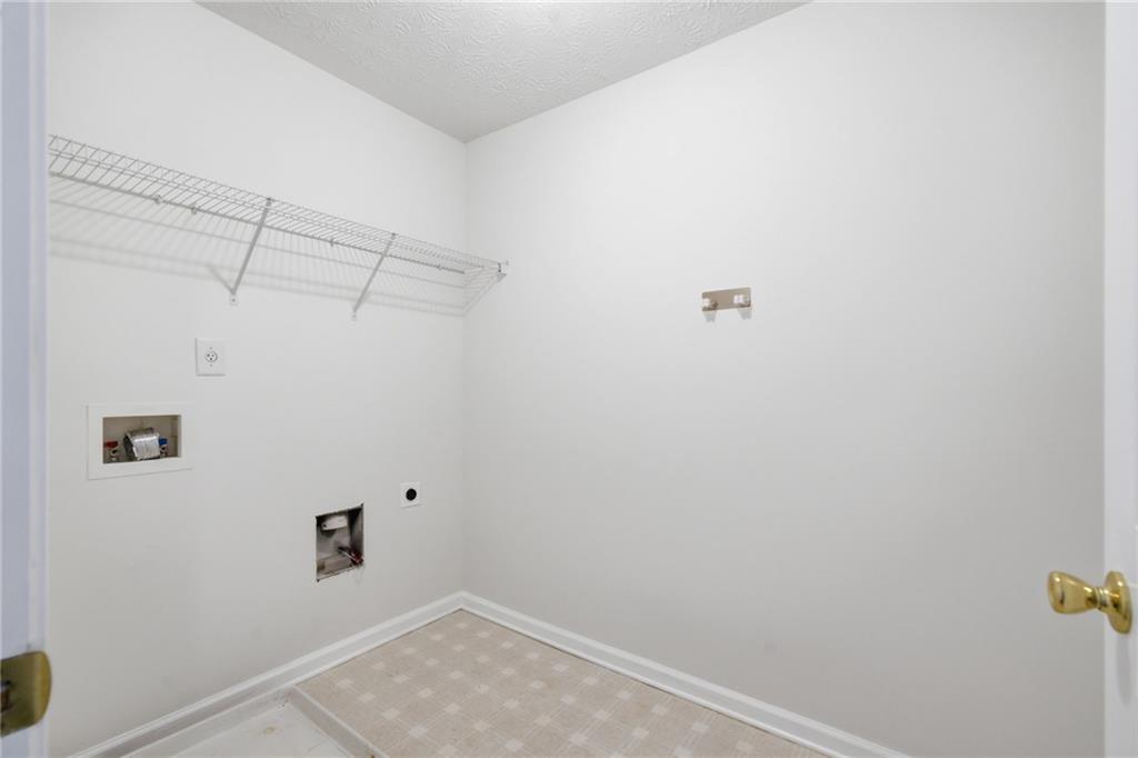 2913 Greyhawk Lane Cumming, GA 30040 - Photo 29 of 44 a view of a room with racks on the wall