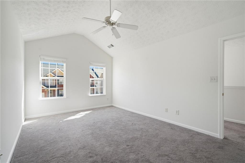2913 Greyhawk Lane Cumming, GA 30040 - Photo 5 of 44 a view of an empty room with a window