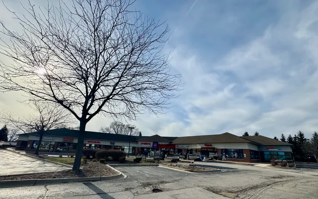 a kitchen with a stove and a refrigerator