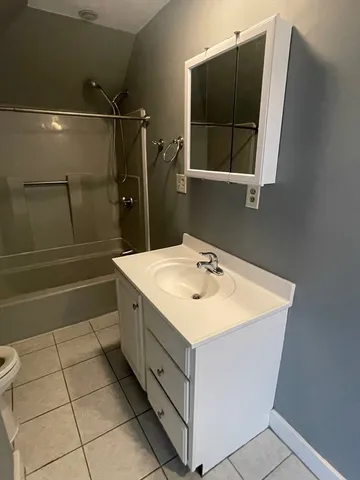 a bathroom with a sink a vanity and a mirror