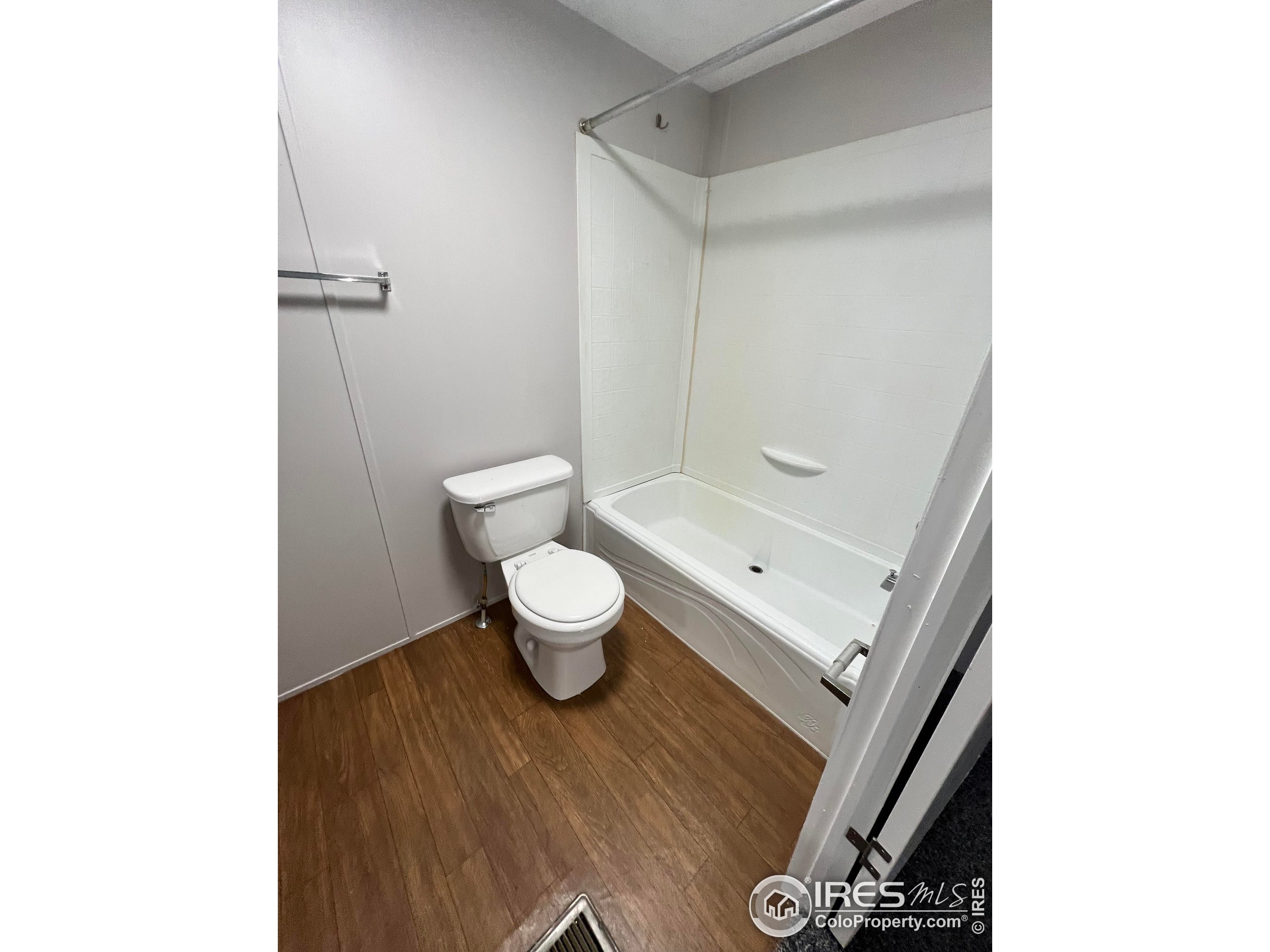 230 North 2nd Street, Unit 7 Berthoud, CO 80513 - Photo 11 of 14 a bathroom with a toilet and a shower