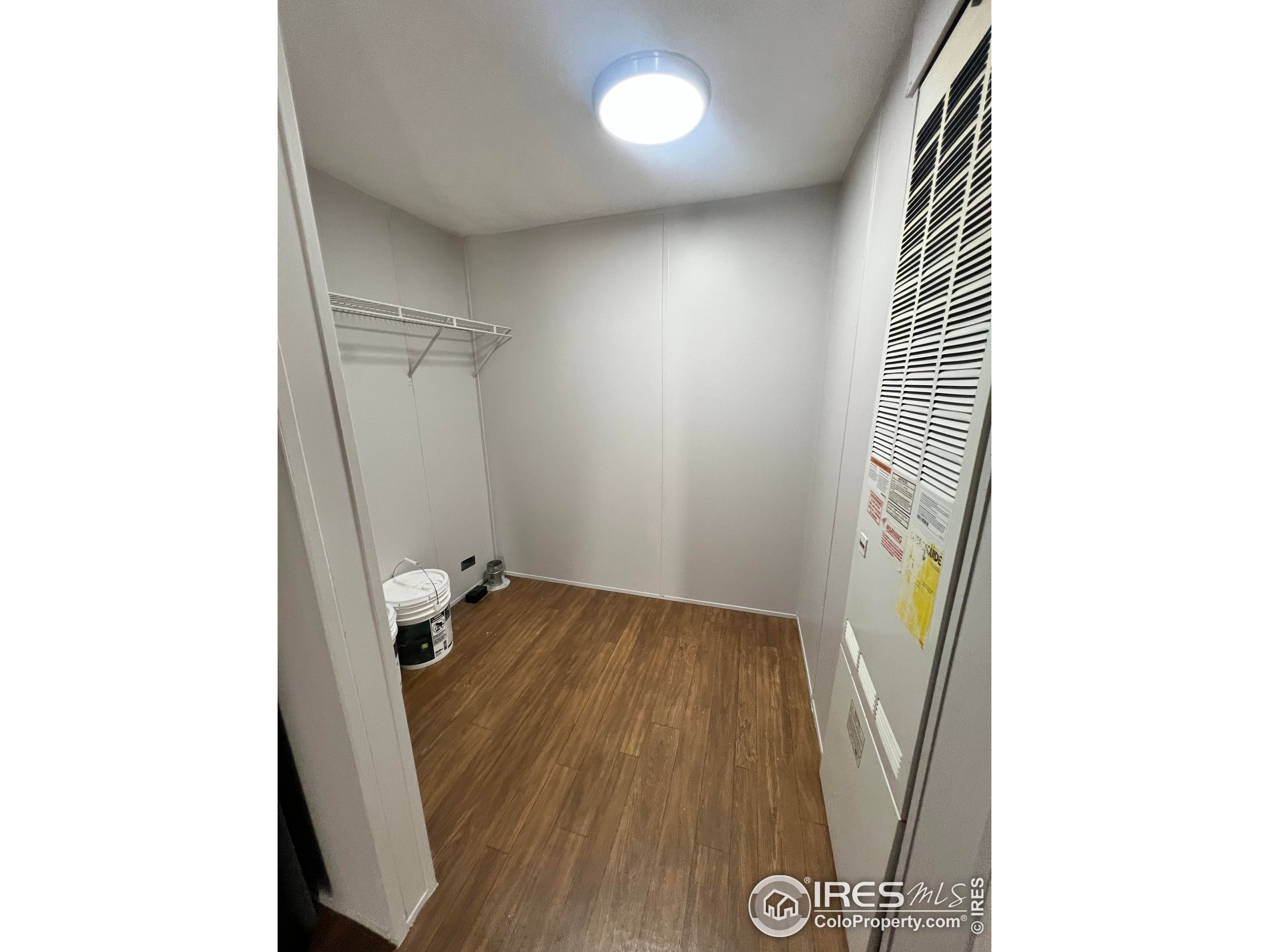 230 North 2nd Street, Unit 7 Berthoud, CO 80513 - Photo 13 of 14 a view of hallway with a large window and wooden floor